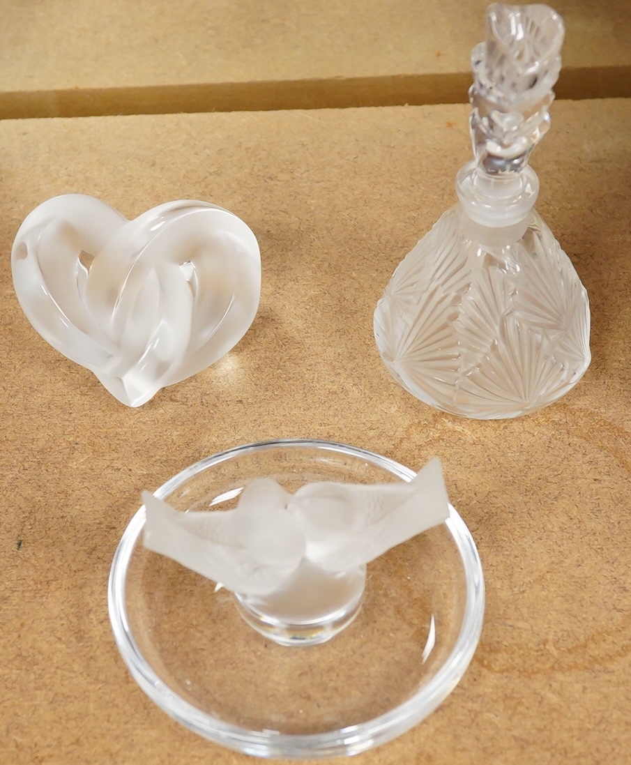 A Lalique scent bottle with stopper, a Lalique lovebirds pin-dish and and a Lalique heart-shape knot, scent bottle 12cm